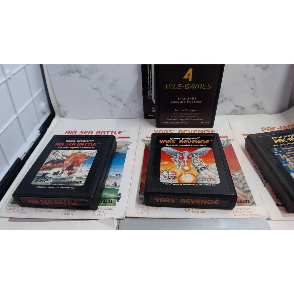 Lot of 7 Atari 2600 Games with Manuals Star Raiders Pac-Man Yars Revenge NTSC